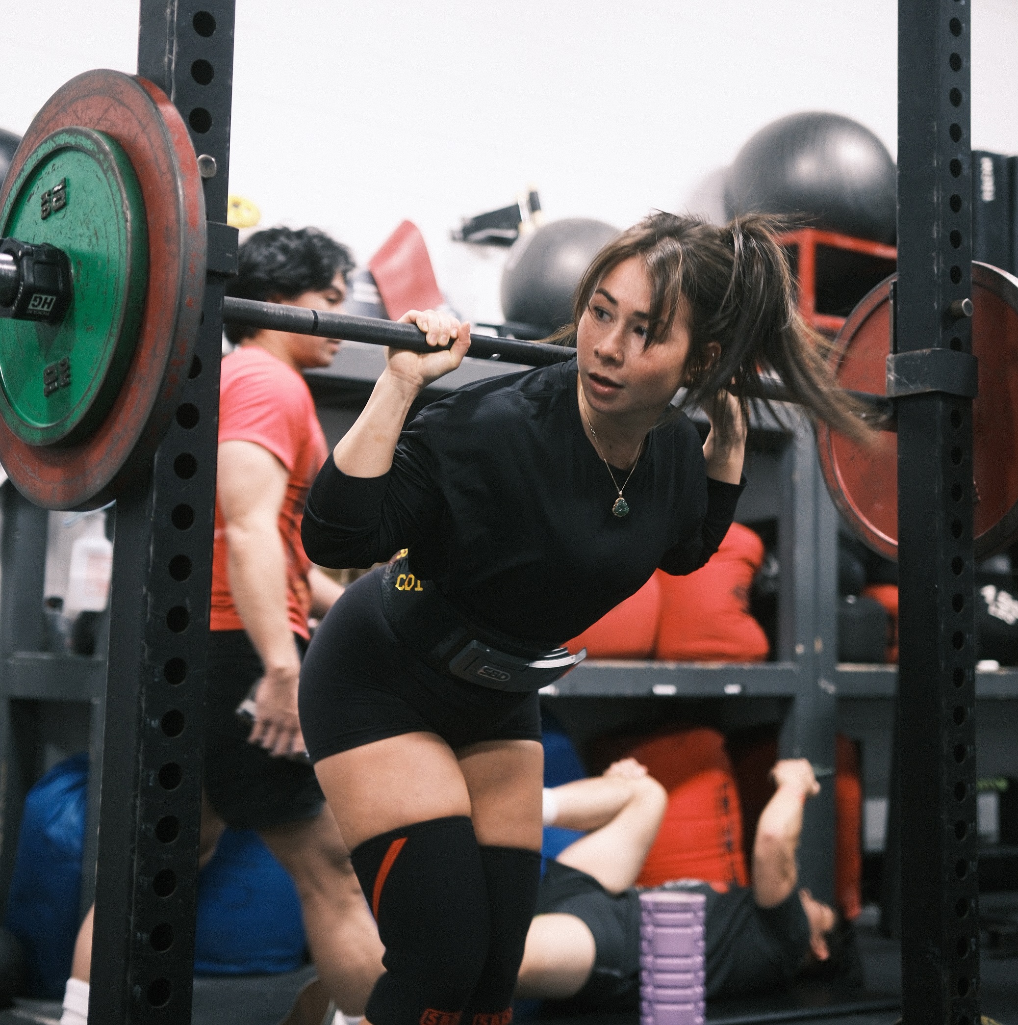 Andrea re racking a squat